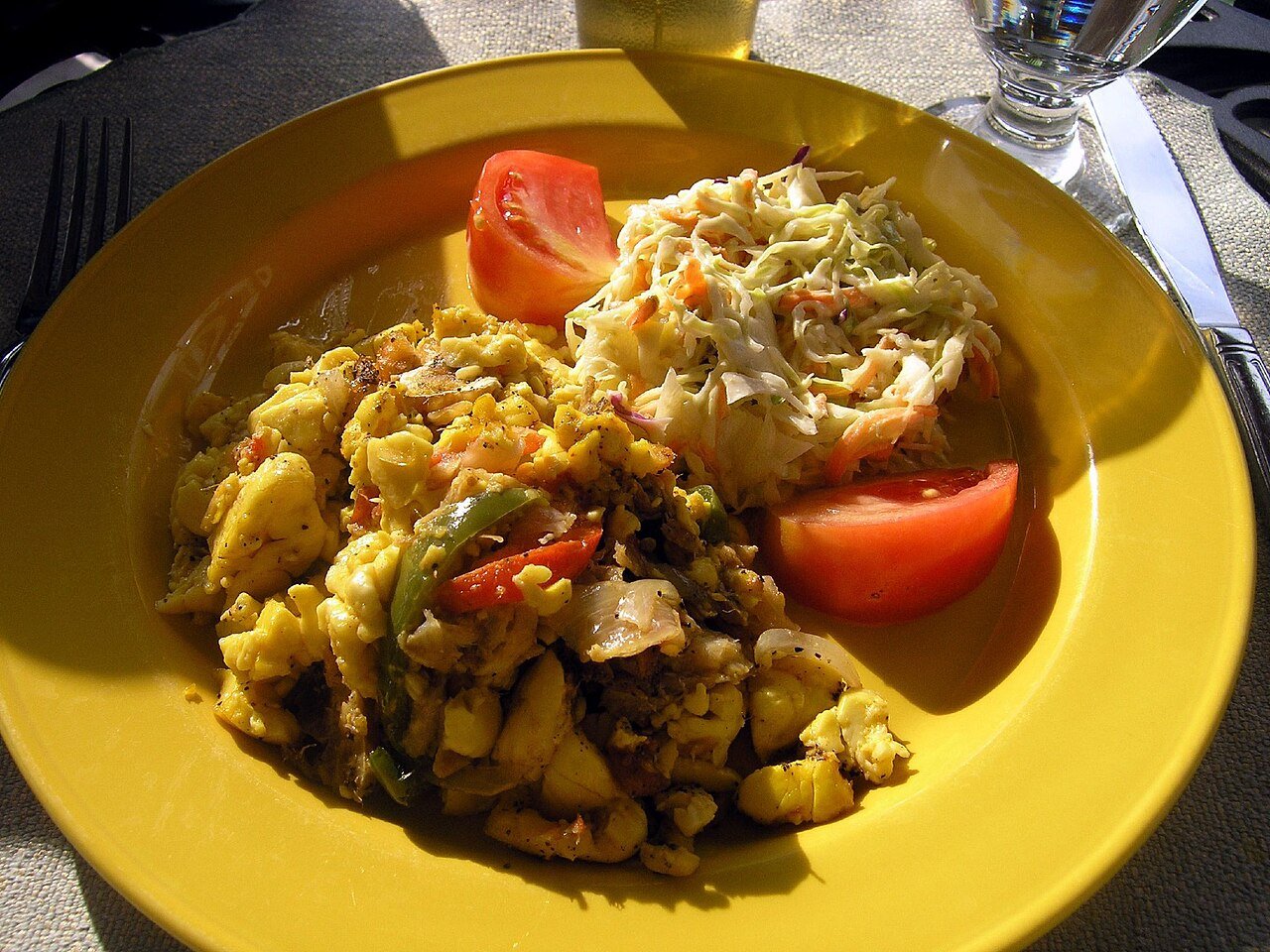Representative photograph of Ackee and Saltfish. The photograph includes salad and other accompaniments not included in this draft.