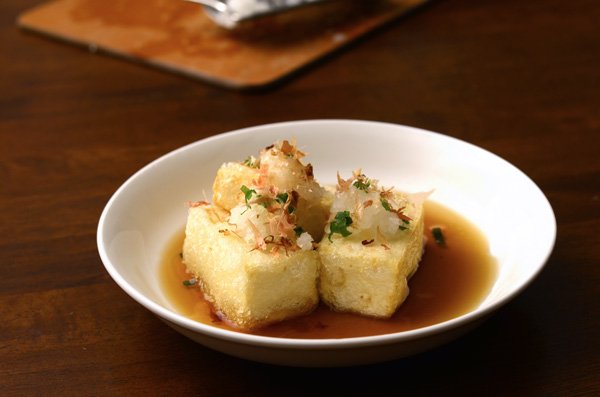 Representative photograph of Agedashi Tofu. The photograph includes bonito-style flakes; this draft uses kombu broth without fish flakes.