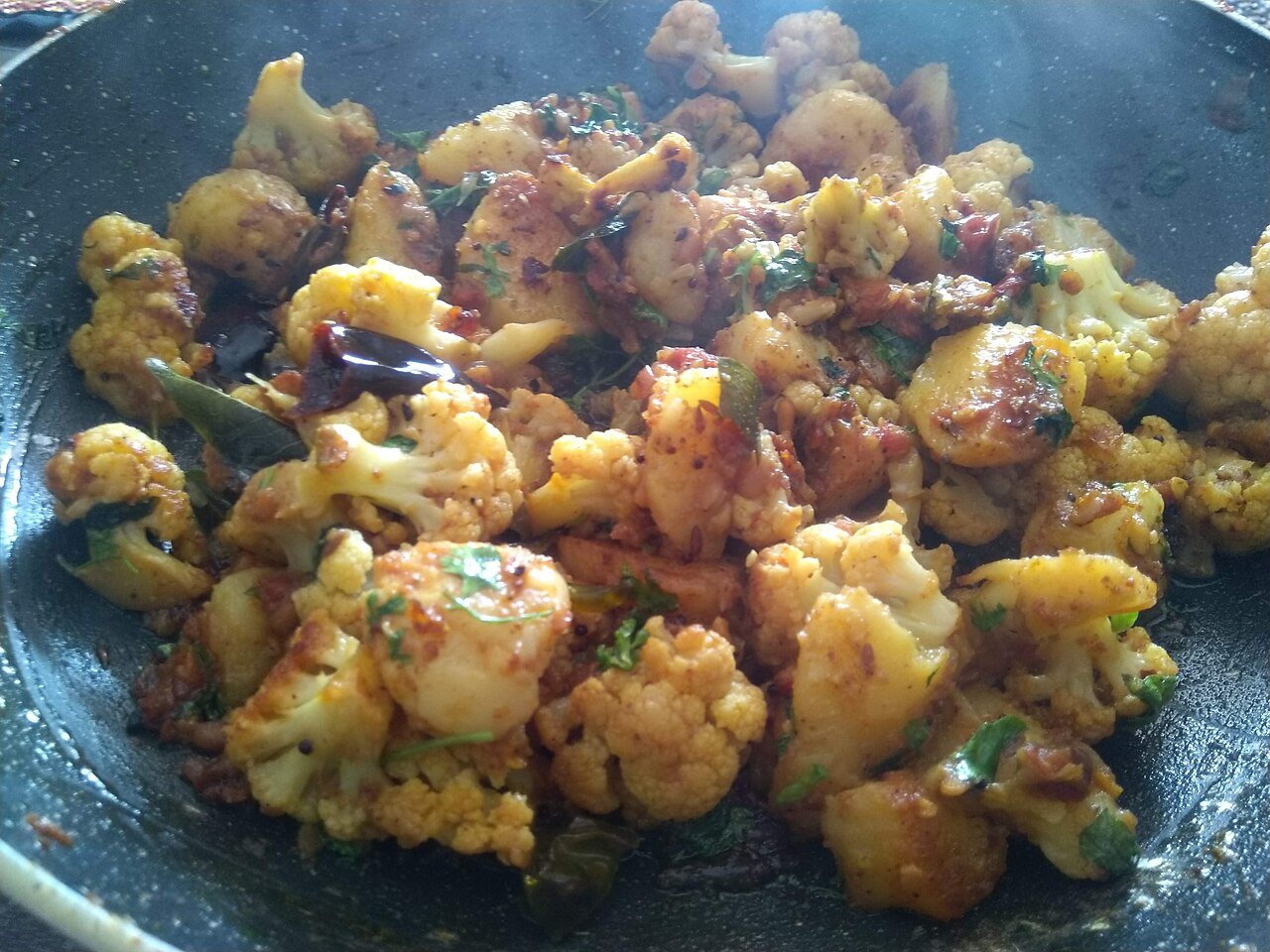 Potato and cauliflower cooked in a skillet