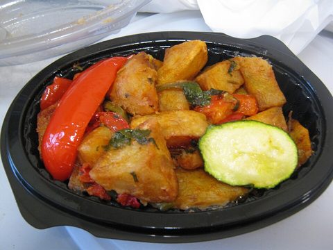 Representative photograph of Batata Harra. The photo includes pepper and cucumber garnish.