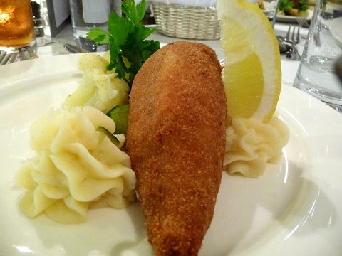 Representative photograph of Chicken Kyiv. The photograph includes mashed potatoes and garnish not included in this draft.