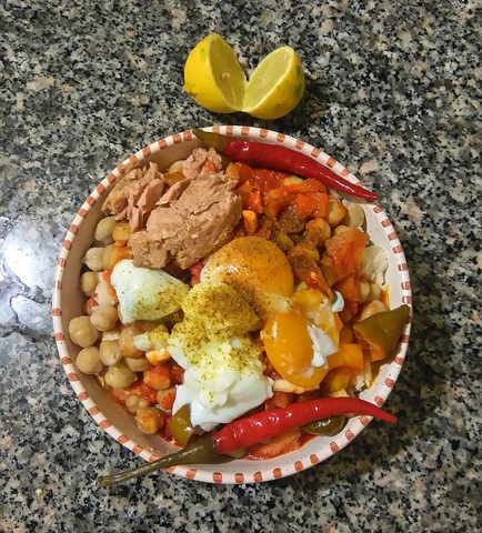 Representative photograph of Lablabi. The photograph includes egg and tuna toppings; this draft uses chickpeas and bread without these toppings.