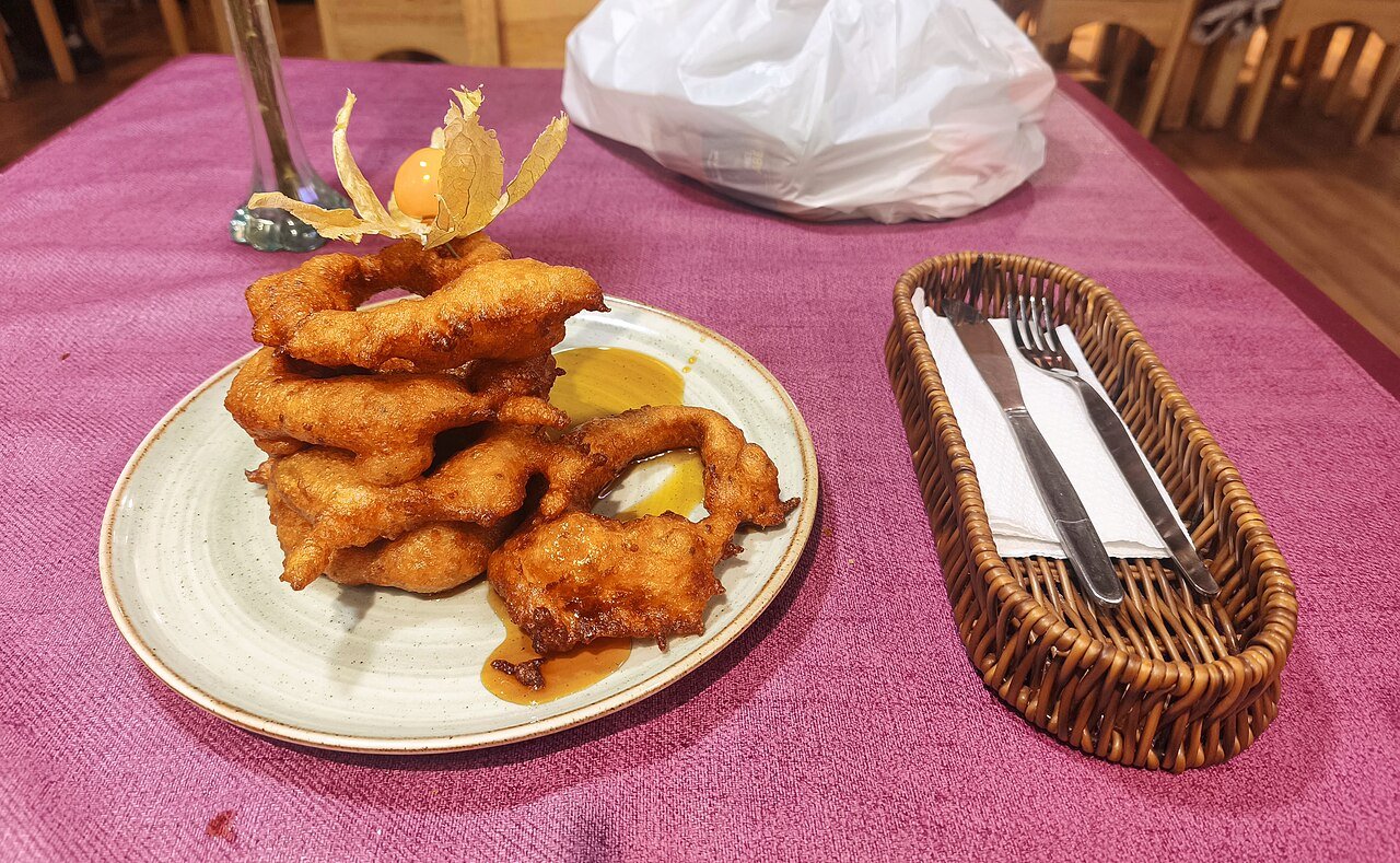 Representative photograph of Picarones. The photograph includes citrus garnish not included in this draft.