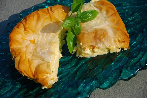Representative photograph of Tiropita. The photograph shows a folded cheese pie; this draft makes a layered tray pie.