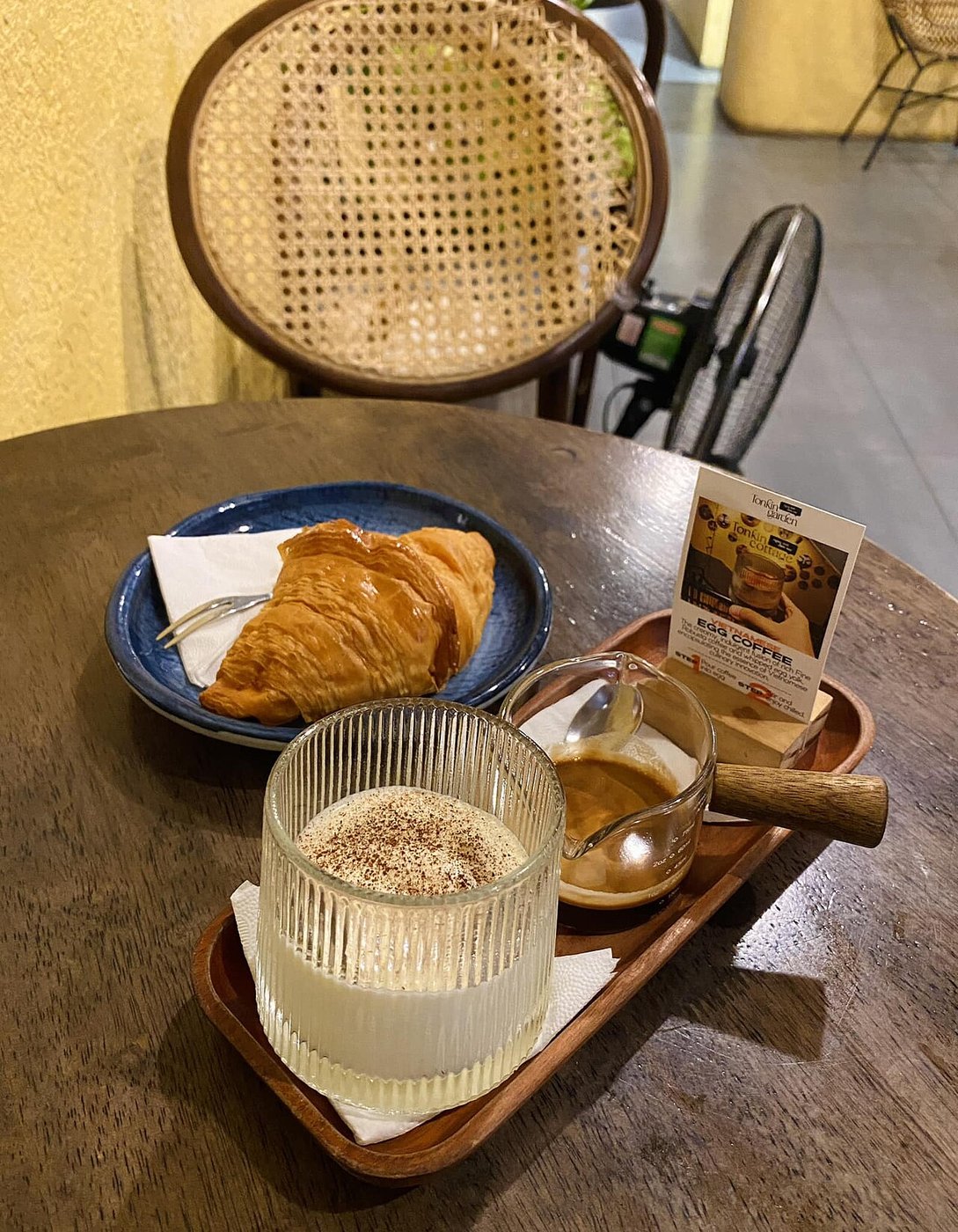 Representative photograph of Vietnamese Egg Coffee. The photograph includes pastries and table accompaniments not included in this coffee recipe.